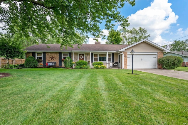 1308 N Buckeye Rd, Muncie, IN 47304 - single story home with brick siding, an attached garage, concrete driveway, and a chimney