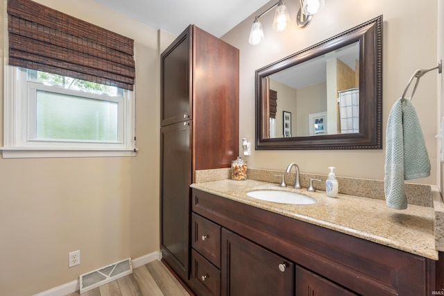 1308 N Buckeye Rd, Muncie, IN 47304 - bathroom with vanity and wood finished floors