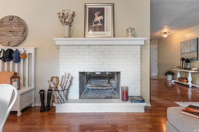 1308 N Buckeye Rd, Muncie, IN 47304 - detailed view of wood finished floors and a brick fireplace