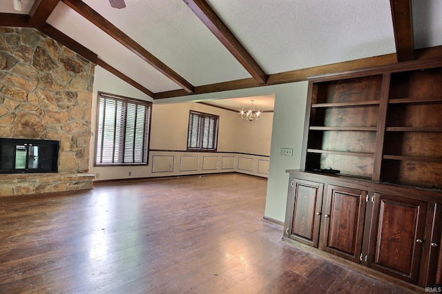 8426 Creekside Pl, Fort Wayne, IN 46804 - unfurnished living room with a chandelier, dark wood-style floors, and a fireplace