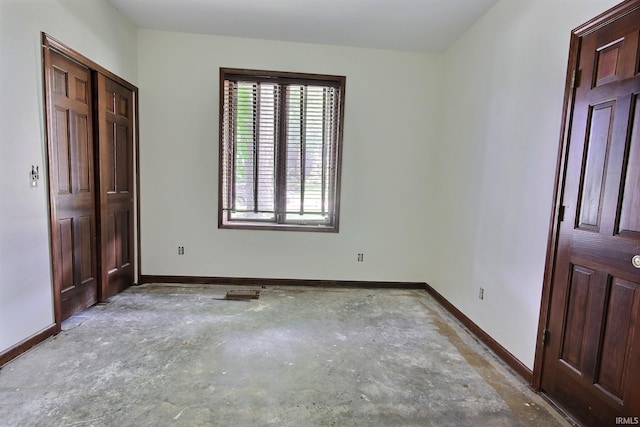 8426 Creekside Pl, Fort Wayne, IN 46804 - unfurnished bedroom featuring concrete floors and baseboards