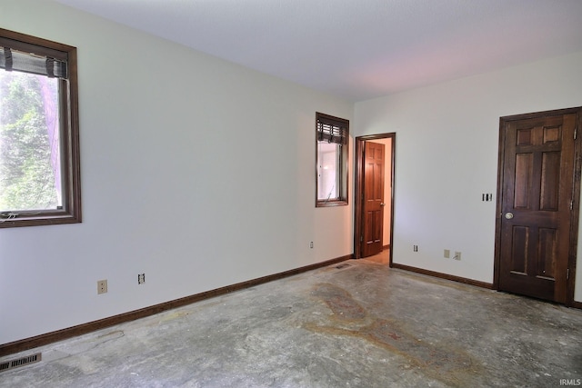 8426 Creekside Pl, Fort Wayne, IN 46804 - spare room with concrete flooring and baseboards