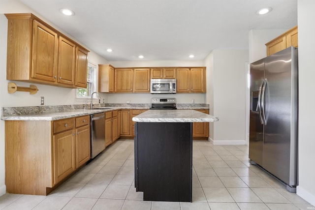 3746 Rolling Rock Dr, Evansville, IN 47711 - kitchen with stainless steel appliances, a kitchen island, light countertops, recessed lighting, and light tile patterned floors