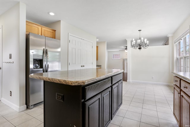 3746 Rolling Rock Dr, Evansville, IN 47711 - kitchen with stainless steel refrigerator with ice dispenser, light tile patterned floors, a chandelier, a kitchen island, and recessed lighting