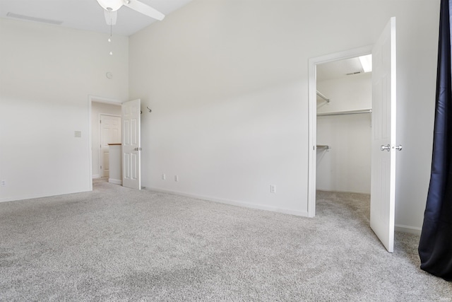 3746 Rolling Rock Dr, Evansville, IN 47711 - unfurnished bedroom featuring carpet flooring, high vaulted ceiling, a walk in closet, and a closet