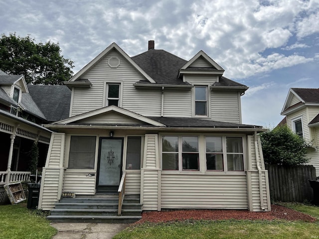 1026 E Wayne St, South Bend, IN 46617 - view of front of property with a chimney, entry steps, and roof with shingles