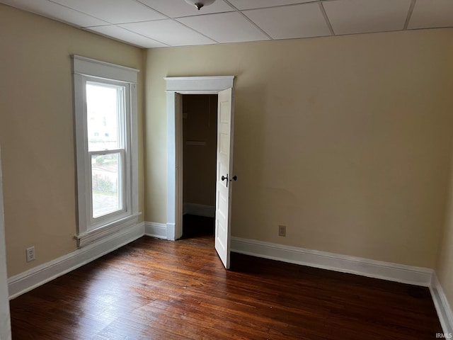 1026 E Wayne St, South Bend, IN 46617 - empty room featuring healthy amount of natural light and dark wood finished floors