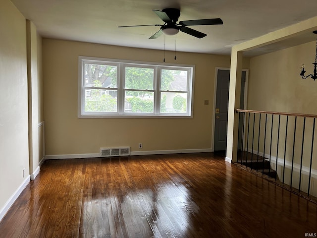 1026 E Wayne St, South Bend, IN 46617 - unfurnished room with dark wood-style floors and a ceiling fan