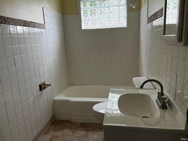 1026 E Wayne St, South Bend, IN 46617 - full bath featuring tile walls, vanity, and bathtub / shower combination