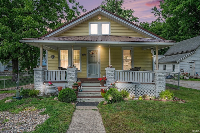 405 Middlebury St, Goshen, IN 46528 - bungalow featuring covered porch and a metal roof