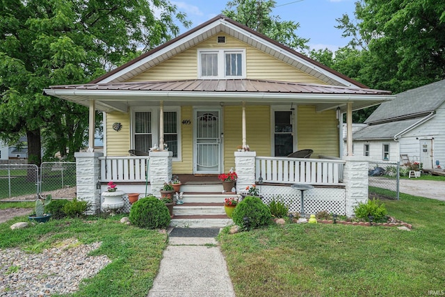 405 Middlebury St, Goshen, IN 46528 - view of front of house featuring a porch and a metal roof