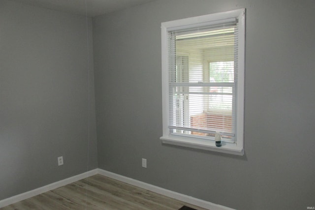 907 S Tennessee, Muncie, IN 47302 - unfurnished room featuring baseboards and wood finished floors