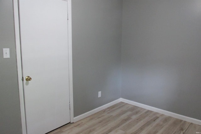 907 S Tennessee, Muncie, IN 47302 - unfurnished bedroom with light wood finished floors and a closet