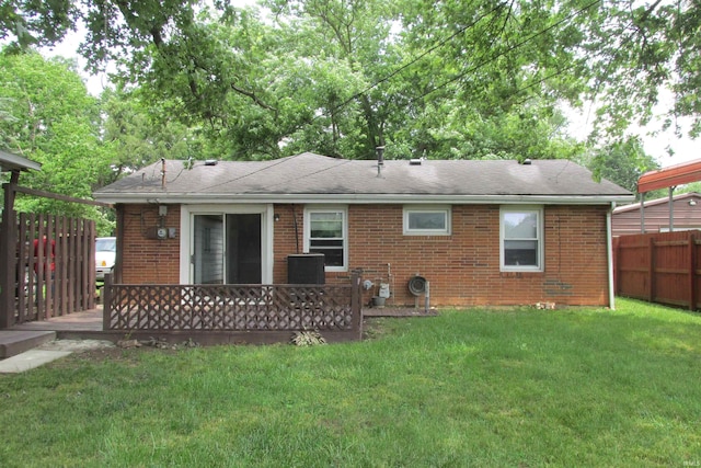 907 S Tennessee, Muncie, IN 47302 - rear view of house featuring brick siding, a deck, and a shingled roof