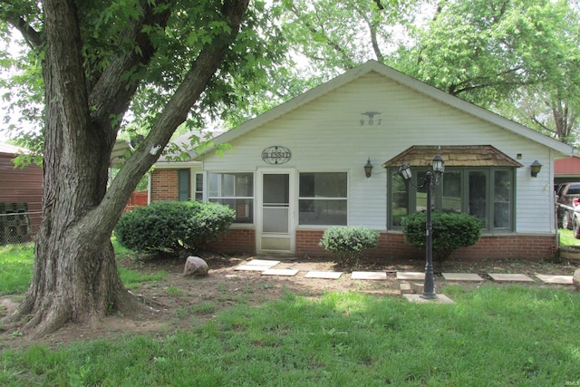 907 S Tennessee, Muncie, IN 47302 - bungalow-style house with brick siding and a front yard