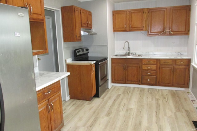 907 S Tennessee, Muncie, IN 47302 - kitchen featuring stainless steel appliances, under cabinet range hood, and brown cabinets