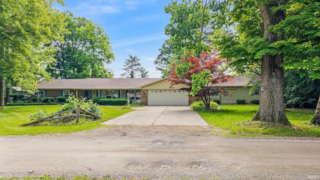 16801 Darling Rd, Woodburn, IN 46797 - single story home featuring an attached garage, driveway, a front yard, and brick siding