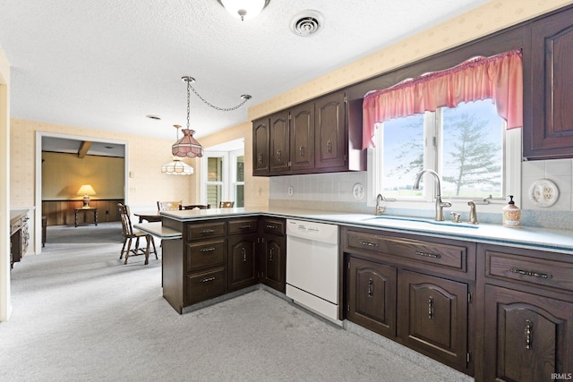 16801 Darling Rd, Woodburn, IN 46797 - kitchen featuring white dishwasher, light countertops, dark brown cabinets, a peninsula, and a textured ceiling