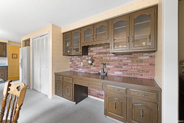 16801 Darling Rd, Woodburn, IN 46797 - kitchen featuring dark countertops, a textured ceiling, white fridge with ice dispenser, light carpet, and an office area