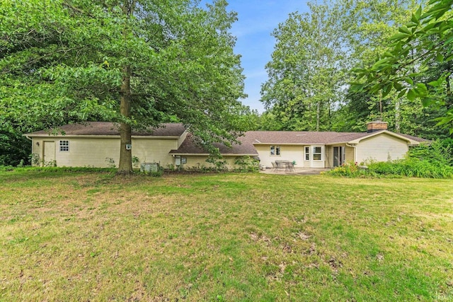 16801 Darling Rd, Woodburn, IN 46797 - view of grassy yard featuring a patio