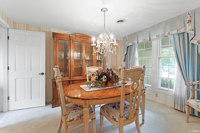 16801 Darling Rd, Woodburn, IN 46797 - dining room featuring a chandelier and light carpet