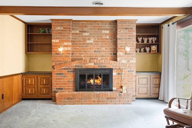 16801 Darling Rd, Woodburn, IN 46797 - living area featuring a brick fireplace, carpet flooring, a wainscoted wall, and wood walls