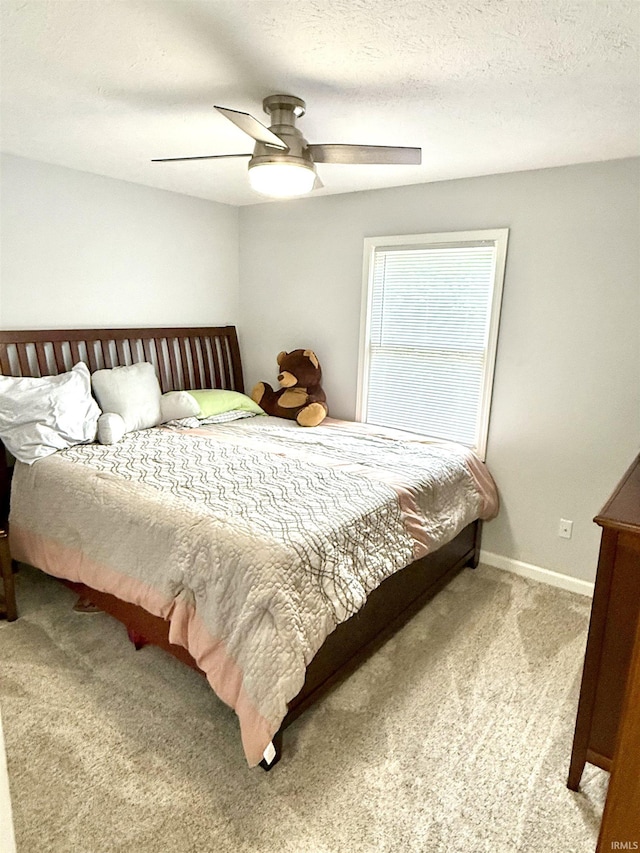 5918 S Foxwood Ln, Bloomington, IN 47401 - bedroom featuring carpet flooring and a ceiling fan