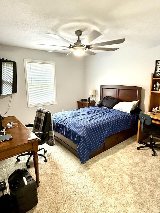 5918 S Foxwood Ln, Bloomington, IN 47401 - carpeted bedroom with an office area, a ceiling fan, and a textured ceiling