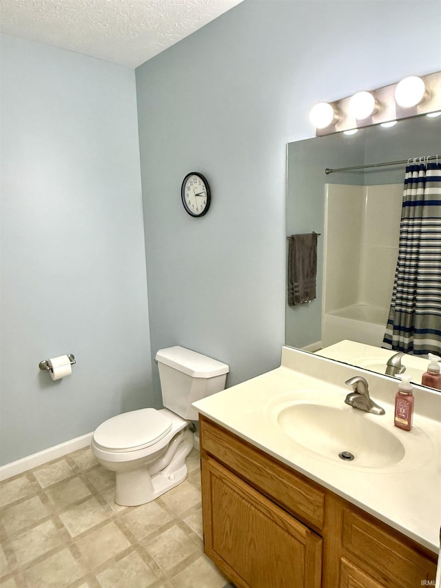 5918 S Foxwood Ln, Bloomington, IN 47401 - bathroom with a shower with shower curtain, vanity, and a textured ceiling