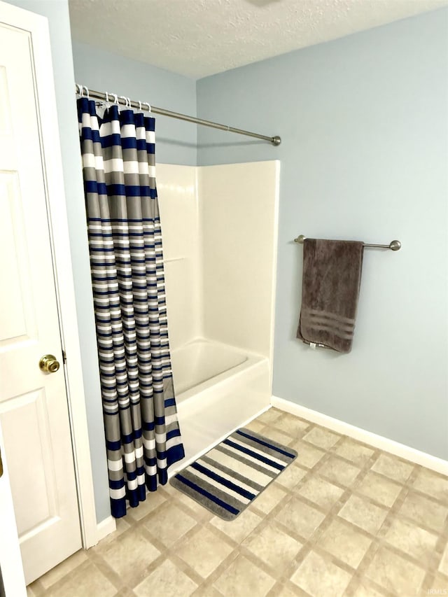 5918 S Foxwood Ln, Bloomington, IN 47401 - full bathroom featuring shower / tub combo with curtain and a textured ceiling
