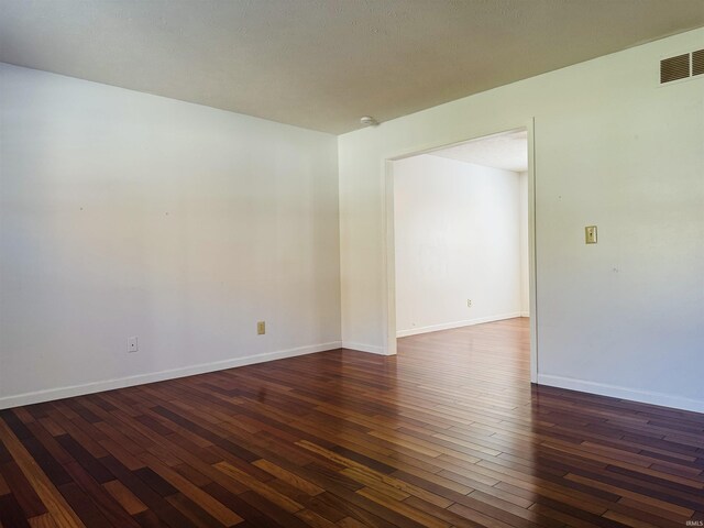 687 N Deer Lake Dr, Bloomfield, IN 47424 - spare room featuring dark wood-style floors and a smoke detector