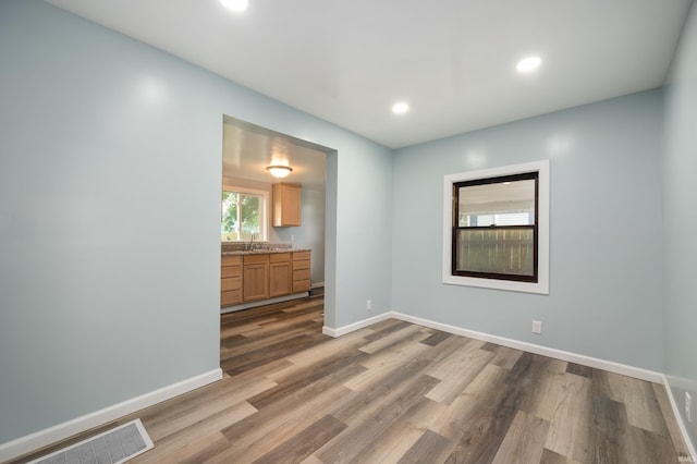 32 W Main St, Redkey, IN 47373 - spare room featuring wood finished floors and recessed lighting