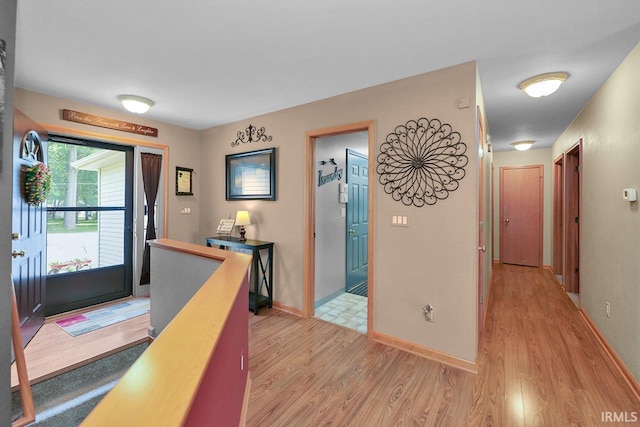 29876 County Road 18th Rd, Elkhart, IN 46517 - hallway featuring light wood-style floors and an upstairs landing