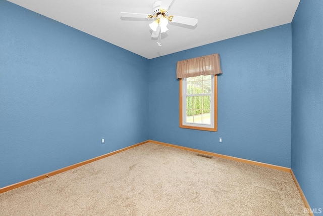 29876 County Road 18th Rd, Elkhart, IN 46517 - spare room featuring carpet flooring and a ceiling fan