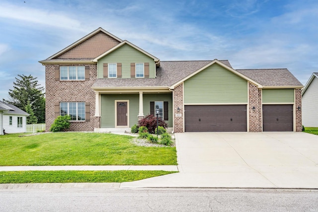 625 Perolla Dr, Fort Wayne, IN 46845 - craftsman-style home with a garage, brick siding, a front yard, driveway, and a shingled roof
