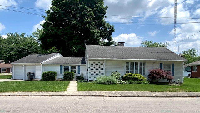 401 College Ave, Winona Lake, IN 46590 - view of front of home featuring an attached garage, a chimney, concrete driveway, and a front lawn