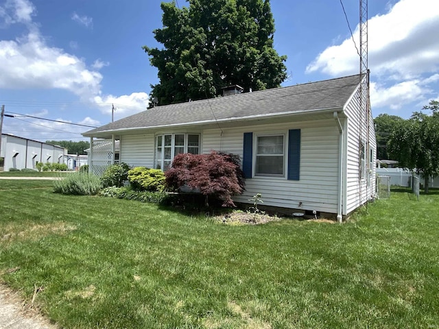 401 College Ave, Winona Lake, IN 46590 - view of front of house with a front yard and roof with shingles