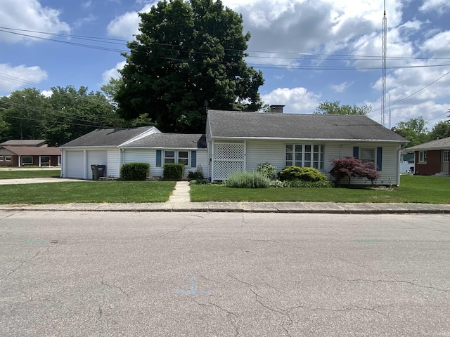 401 College Ave, Winona Lake, IN 46590 - view of front of house featuring a garage, a chimney, a front lawn, and asphalt driveway