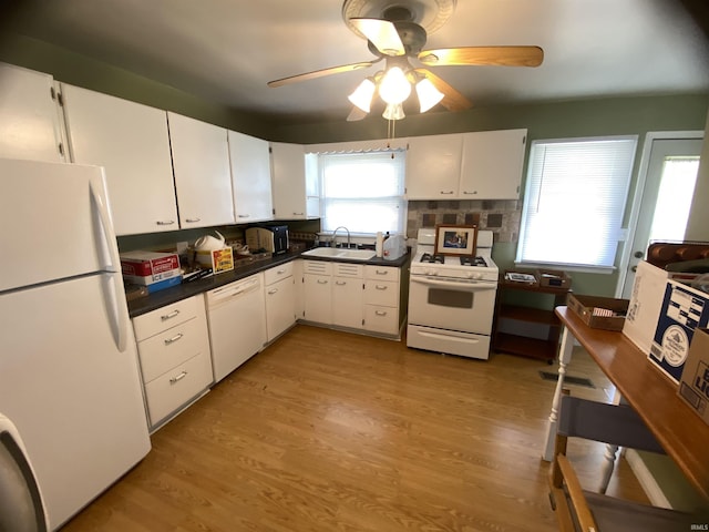401 College Ave, Winona Lake, IN 46590 - kitchen featuring white appliances, white cabinets, a ceiling fan, dark countertops, and light wood-type flooring