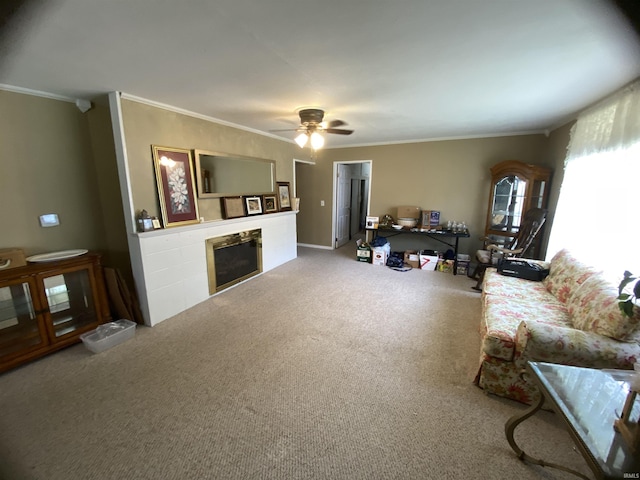 401 College Ave, Winona Lake, IN 46590 - living area featuring crown molding, carpet flooring, a fireplace, and ceiling fan