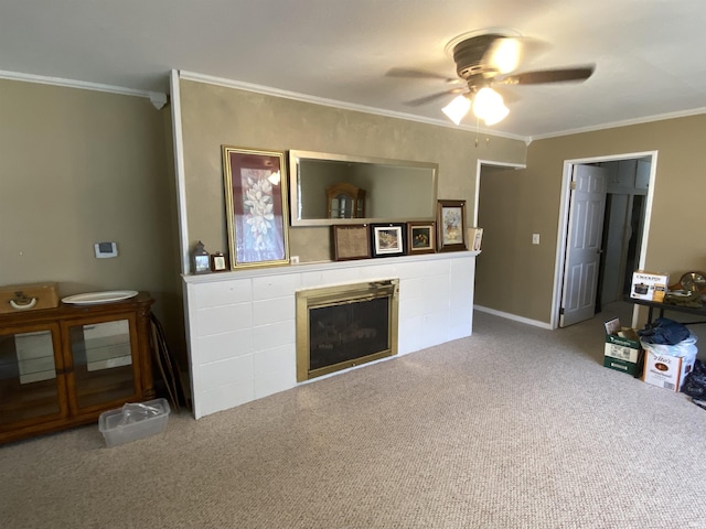 401 College Ave, Winona Lake, IN 46590 - living room featuring ceiling fan, ornamental molding, a fireplace, and carpet flooring