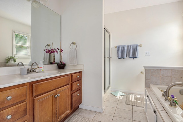 53135 W Cedar Lake Dr, Granger, IN 46530 - full bathroom with tile patterned floors, vanity, a bath, and a stall shower