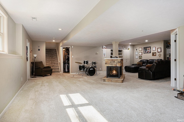 53135 W Cedar Lake Dr, Granger, IN 46530 - carpeted living area featuring stairway, a stone fireplace, and recessed lighting