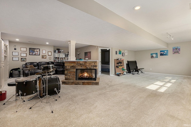 53135 W Cedar Lake Dr, Granger, IN 46530 - carpeted living room with a stone fireplace, recessed lighting, and decorative columns