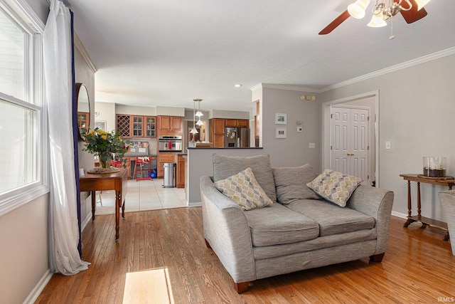 53135 W Cedar Lake Dr, Granger, IN 46530 - living room featuring light wood-style floors, ceiling fan, and ornamental molding