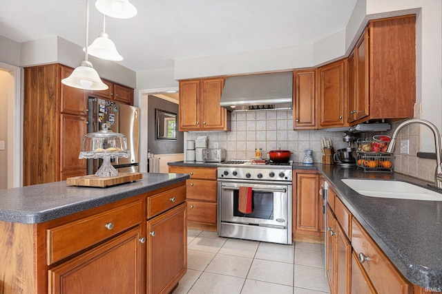 53135 W Cedar Lake Dr, Granger, IN 46530 - kitchen with appliances with stainless steel finishes, wall chimney range hood, dark countertops, brown cabinetry, and decorative backsplash