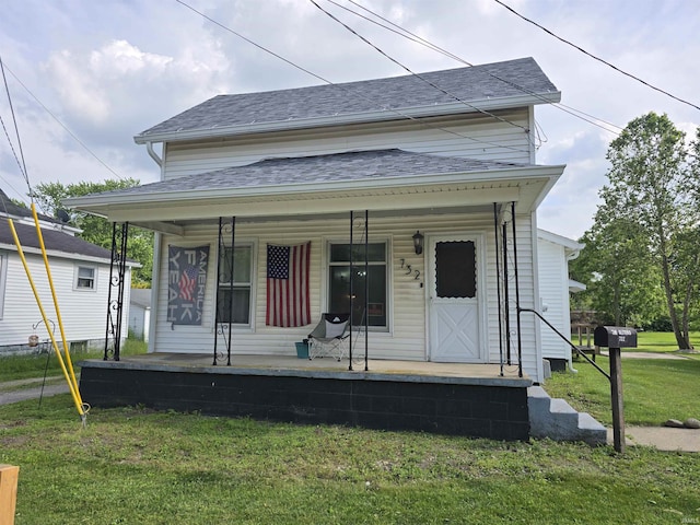 732 Dowling St, Kendallville, IN 46755 - view of front facade with a porch, a front yard, and a shingled roof