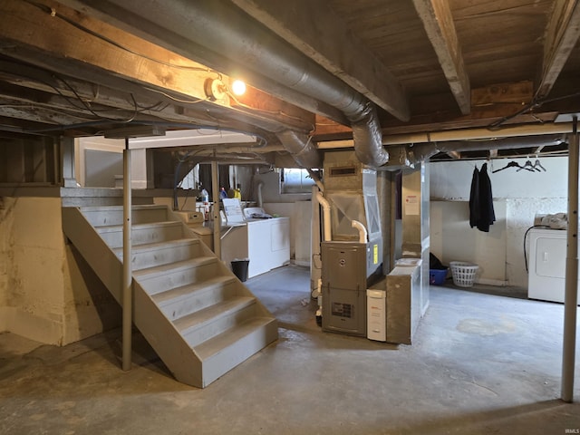 732 Dowling St, Kendallville, IN 46755 - unfinished below grade area featuring stairway, washer and clothes dryer, and heating unit
