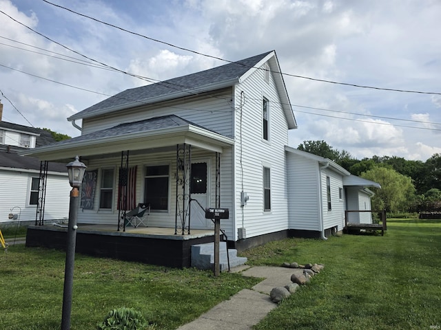 732 Dowling St, Kendallville, IN 46755 - view of front of house with a porch and a front lawn