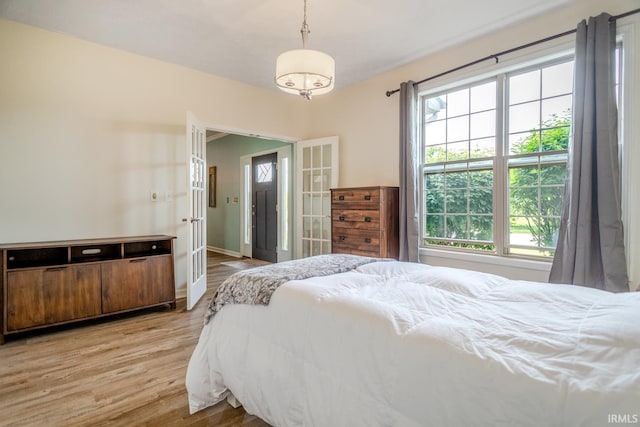 2007 Kingfisher Dr, Lafayette, IN 47909 - bedroom featuring multiple windows, french doors, and light wood-style floors